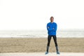 Cool sporty guy standing at the beach Royalty Free Stock Photo