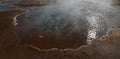 Cool steaming geysir in Iceland surrounded by minerals Royalty Free Stock Photo