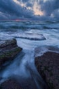 Cool stormy beach sunset  with sun Royalty Free Stock Photo