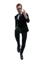 Cool stylish man in black suit holding knee up