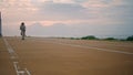 Cool teen balancing longboard embankment. Skater man riding road making tricks Royalty Free Stock Photo