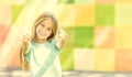 Cool teen girl shows thumbs up Royalty Free Stock Photo