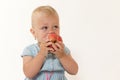 Cool toddler girl is eating red apple Royalty Free Stock Photo