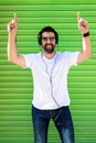 Cool trendy funny beard man in headphones listening music on colored background Royalty Free Stock Photo