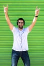 Cool trendy funny beard man in headphones listening music on colored background Royalty Free Stock Photo