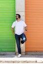 Cool trendy funny beard man in headphones listening music on colored background Royalty Free Stock Photo