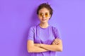 Cool trendy girl in sunglasses looks at camera posing Royalty Free Stock Photo