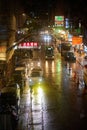 Cool urban traffic shot of Sai Yeung Choi Street South on a rainy night in Mong Kok, Hong Kong. Royalty Free Stock Photo