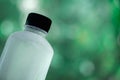 Cool water bottle against on blur of nature background Royalty Free Stock Photo
