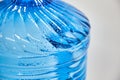 Cool water and water drops on a blue plastic bottle . Selective focus. Royalty Free Stock Photo