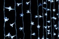 Cool-white string lights on dark background. Royalty Free Stock Photo