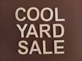 cool yard sale sign on a brown background Royalty Free Stock Photo