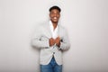 Cool young african american businessman smiling against gray background Royalty Free Stock Photo