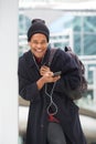 Cool young african american man listening to music with earphones and mobile phone Royalty Free Stock Photo