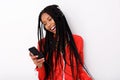 Cool young african american woman listening music with headphone and mobile phone Royalty Free Stock Photo