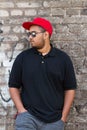 Cool young african boy in red snapback cap Royalty Free Stock Photo