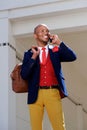 Cool young african man in suit talking on mobile phone Royalty Free Stock Photo