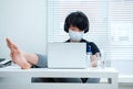 Cool young Asian boy in home-quarantine  doing homework Royalty Free Stock Photo