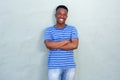 Cool young black guy smiling against wall Royalty Free Stock Photo