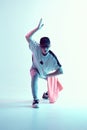Cool young breakdancer guy in studio in neon light. Dance school poster. Battle competition announcement