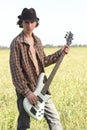 Cool young guitarist outdoors Royalty Free Stock Photo