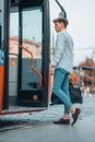 Cool young Spanish male riding up a bus Royalty Free Stock Photo