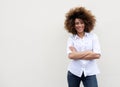 Cool young woman smiling with arms crossed Royalty Free Stock Photo