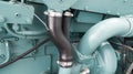 Coolant rubber hose in diesel engines with metal clamper.