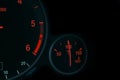 Coolant temperature gauge and tachometer on a car`s dashboard. Modern Car interior details. Close up view