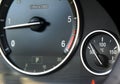 Coolant temperature gauge and tahometer on a car`s dashboard. Car interior details. Close up view. Royalty Free Stock Photo