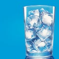 Cooling drink concept Ice cubes in a glass on blue Royalty Free Stock Photo