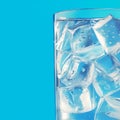 Cooling drink concept Ice cubes in a glass on blue Royalty Free Stock Photo