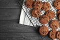 Cooling rack with chocolate chip cookies on wooden background, top view. Royalty Free Stock Photo
