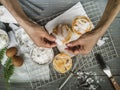 Cooling rack with delicious cupcakes on wooden background, top view Royalty Free Stock Photo