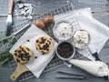 Cooling rack with delicious cupcakes on wooden background, top view Royalty Free Stock Photo