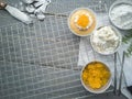 Cooling rack with delicious cupcakes on wooden background, top view Royalty Free Stock Photo