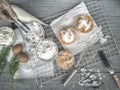 Cooling rack with delicious cupcakes on wooden background, top view Royalty Free Stock Photo