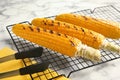 Cooling rack with grilled corn cobs Royalty Free Stock Photo