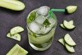 Cooling summer drink with ice and slices of cucumber. Mint and chopped cucumber
