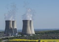 Cooling towers of Nuclear power plant Mochovce,Slovakia,Uni ,2. Field of rapeseed,. Royalty Free Stock Photo