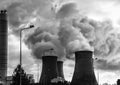 Cooling towers factory industrial spewing pollution and water vapour Royalty Free Stock Photo