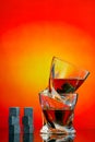 Cooling whiskey stones with twist whiskey glasses against abstract background