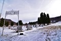 Coon valley cemetery in Winter with the 1876 evangelical Norwegian Lutheran church and drifters area bluffs covered in snow. Royalty Free Stock Photo
