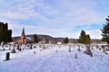 Coon valley cemetery in Winter with the 1876 evangelical Norwegian Lutheran church and drifters area bluffs covered in snow. Royalty Free Stock Photo