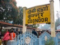 Nilgiri mountain railway. Blue train. People waiting for the train. The train station of