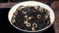 Coooking pasta with squids cuttlefish and ink Royalty Free Stock Photo