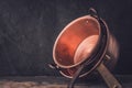 Cooper pots and pans on the stone table horizontal Royalty Free Stock Photo