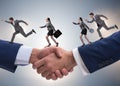 Cooperation concept with people running on handshake Royalty Free Stock Photo