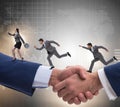 Cooperation concept with people running on handshake Royalty Free Stock Photo