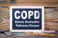 Copd, Chronic obstructive pulmonary disease. Chalkboard on a wooden background